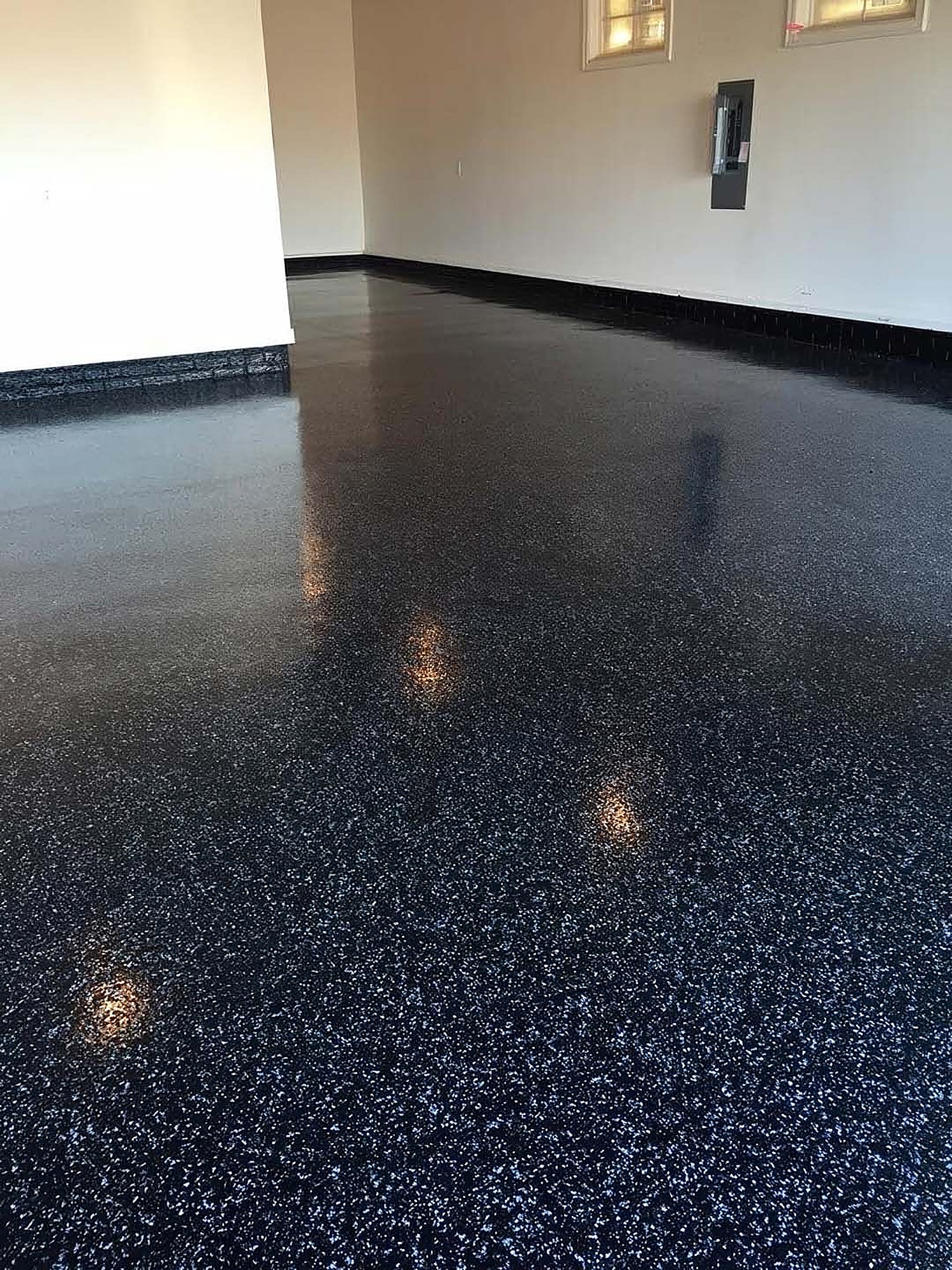 Black and blue flake epoxy garage floor built for a Hurricane Utah shop