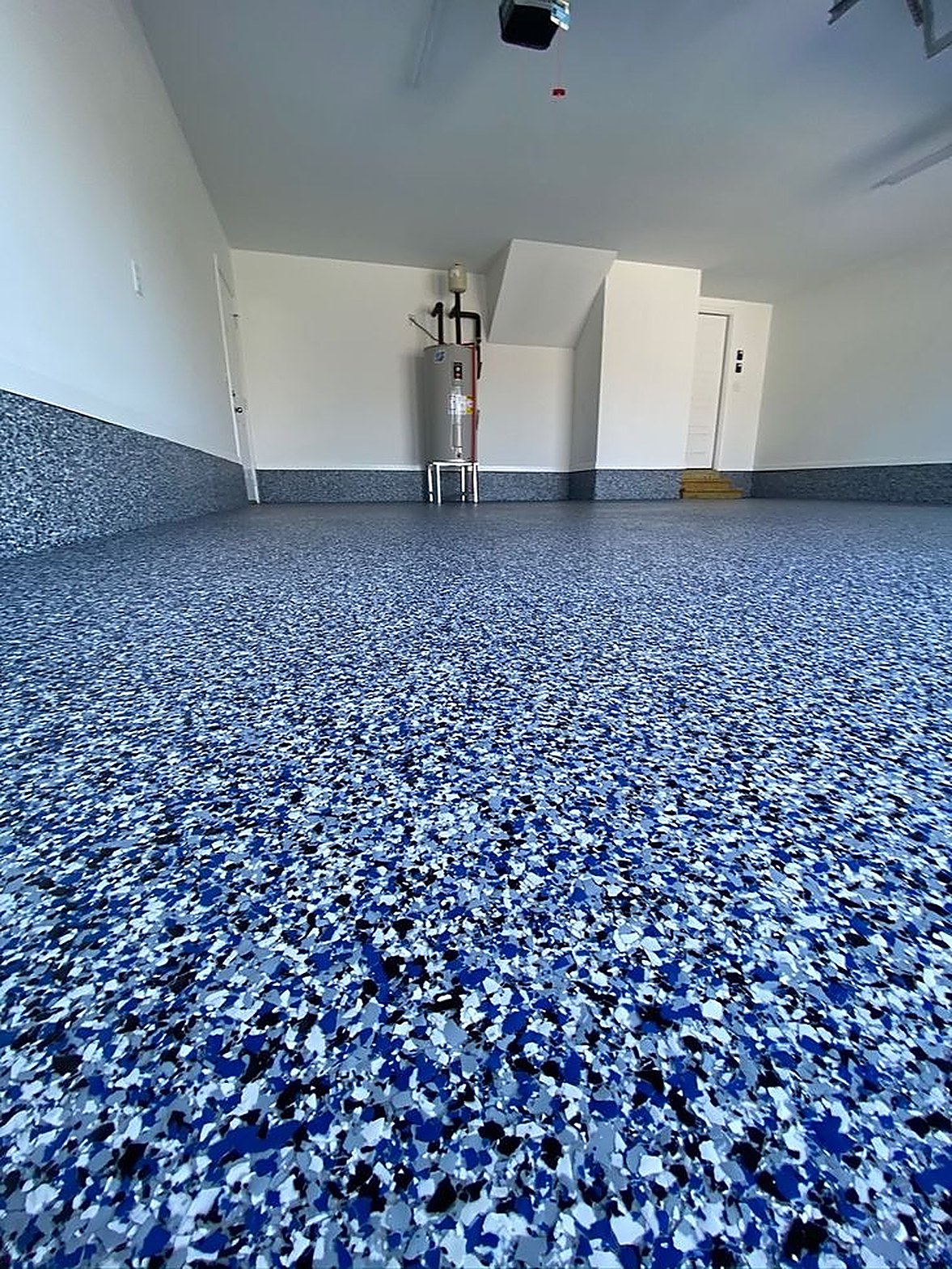 Blue black and white flake epoxy garage floor